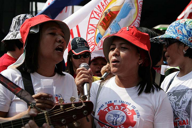 Two women sing protest songs during the May 1 Labor Day Rally in Manila