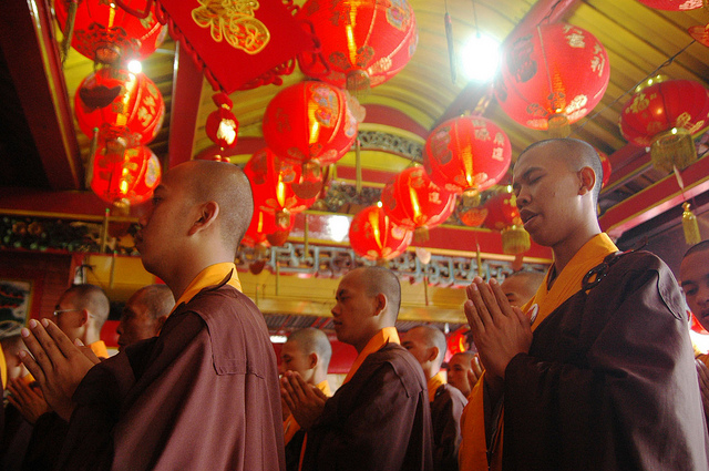Monks pray in Vesak Day (Photo by Miguel Vieira)